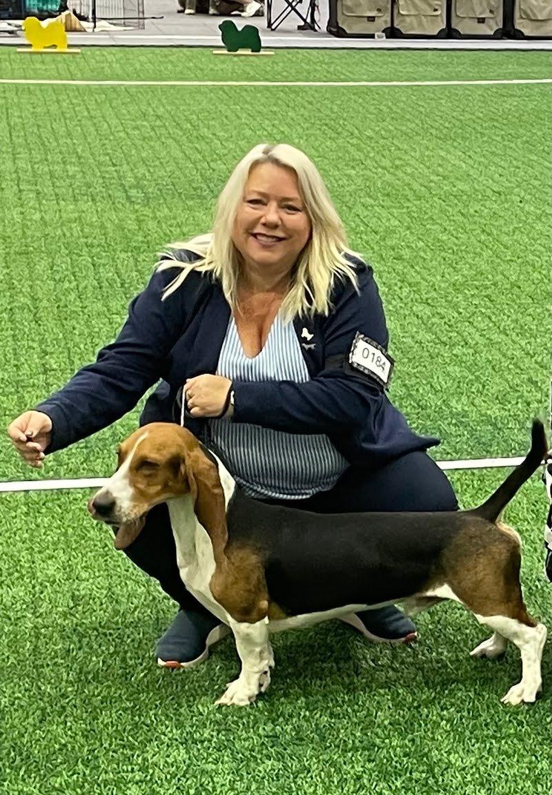 Caroline with her basset hound at a dog show